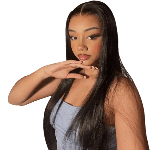 A woman with long straight hair wearing a blue top, standing and looking towards the camera.